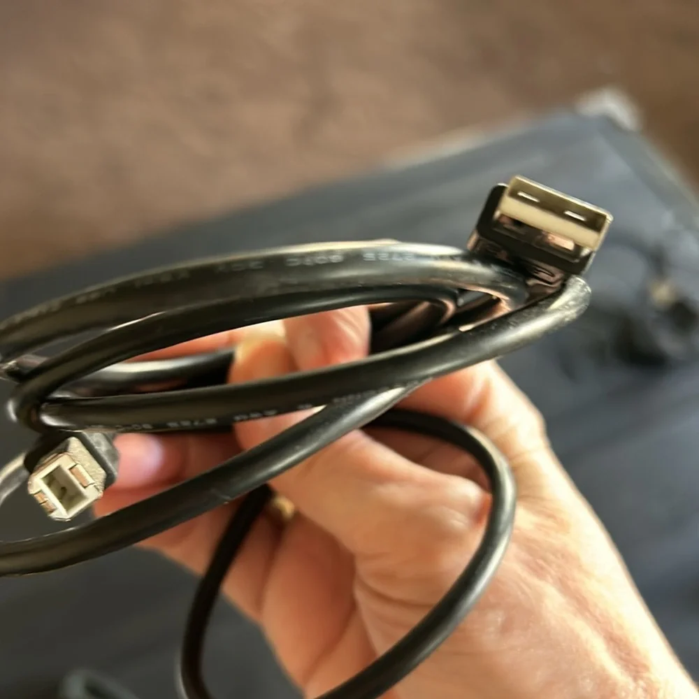 A lot of electronics cables, printer, ethernet